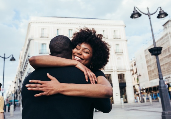 Happy african american couple hugging