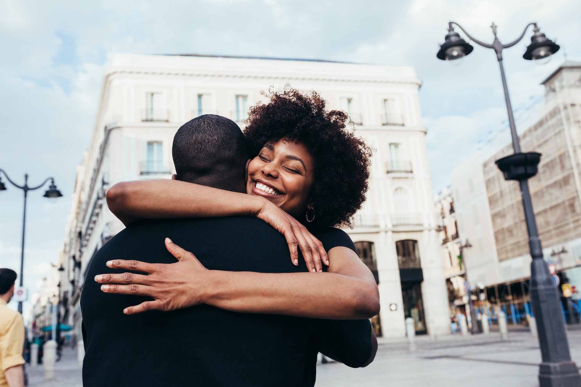 Happy african american couple hugging